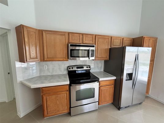 Interior, Kitchen, Stainless Steel Appliances, Tile Countertops