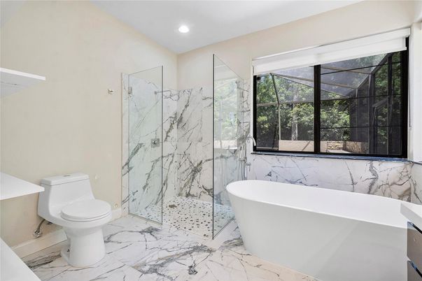 Bathroom, Free Standing Baths, Glass Shower, Interior, Marble, Marble Walls, Recessed Lighting