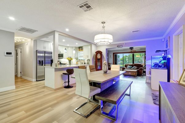 Chandelier, Dining room, Interior, Kitchen, Living room, Pendant Lights, Recessed Lighting, Stainless Steel Appliances, Wood Texture Flooring