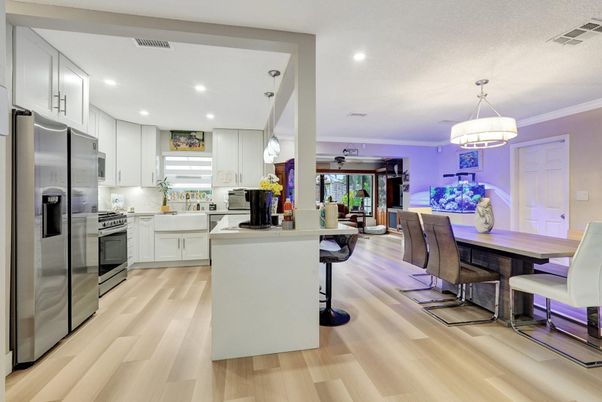 Chandelier, Dining room, Interior, Kitchen, Recessed Lighting, Stainless Steel Appliances, Wood Texture Flooring