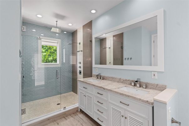 Bathroom, Dual Sink Vanities, Glass Shower, Interior, Recessed Lighting, Wood Texture Flooring