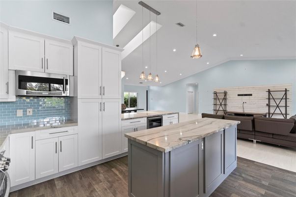 Interior, Kitchen, Pendant Lights, Recessed Lighting, Stainless Steel Appliances, Wood Texture Flooring