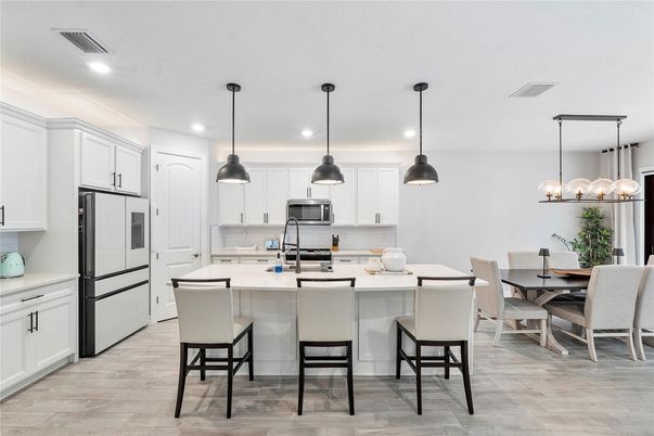 Dining room, Interior, Kitchen, Pendant Lights, Recessed Lighting, Stainless Steel Appliances, Wood Texture Flooring