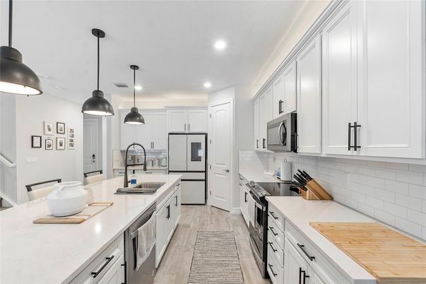Interior, Kitchen, Pendant Lights, Recessed Lighting, Stainless Steel Appliances, Wood Texture Flooring