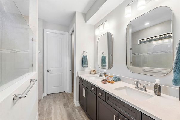 Bathroom, Dual Sink Vanities, Interior, Recessed Lighting, Wood Texture Flooring