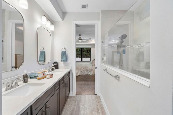 Bathroom, Bedroom, Dual Sink Vanities, Glass Shower, Interior, Wood Texture Flooring