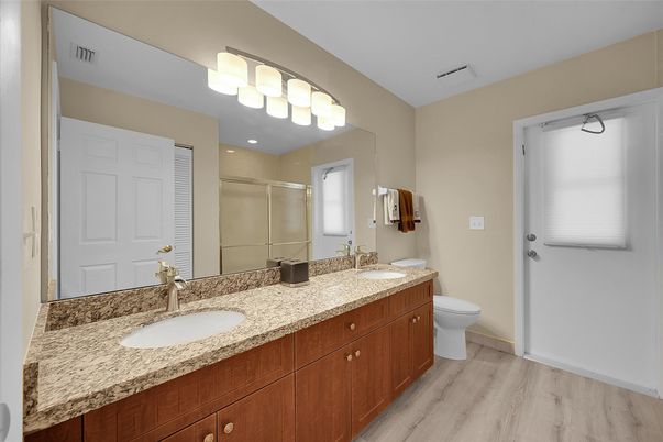 Bathroom, Dual Sink Vanities, Glass Shower, Interior, Wood Texture Flooring