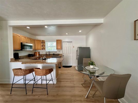 Dining room, Interior, Kitchen, Recessed Lighting, Stainless Steel Appliances, Wood Texture Flooring