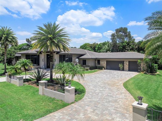 Attached, Backyard, Exterior, Facade, Brick Facade, Spanish Mediterranean