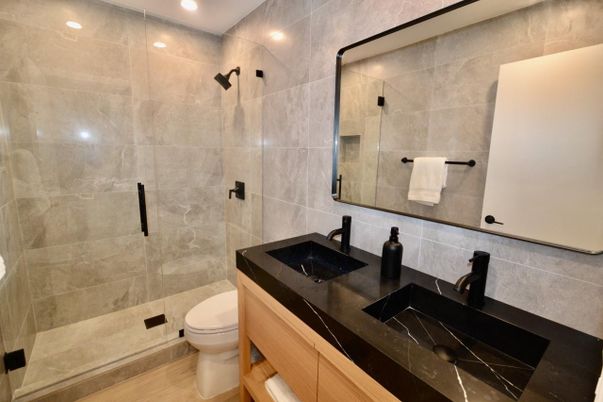 Bathroom, Dual Sink Vanities, Interior, Recessed Lighting, Wood Texture Flooring