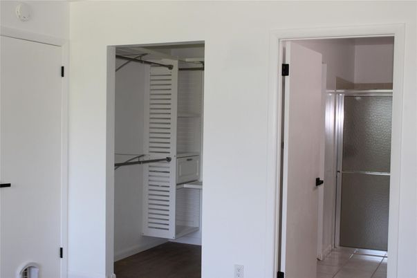Bathroom, Glass Shower, Interior, Walk-in Closets, Wood Texture Flooring