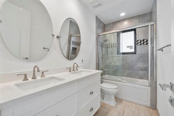 Bathroom, Dual Sink Vanities, Glass Shower, Interior, Recessed Lighting, Wood Texture Flooring