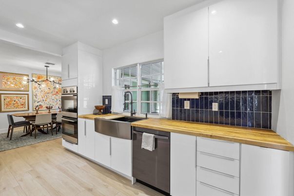 Dining room, Interior, Kitchen, Pendant Lights, Recessed Lighting, Stainless Steel Appliances, Wood Texture Flooring
