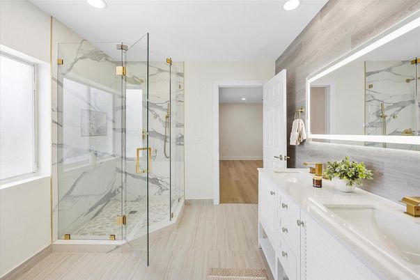 Bathroom, Dual Sink Vanities, Glass Shower, Interior, Marble Walls, Recessed Lighting, Wood Texture Flooring