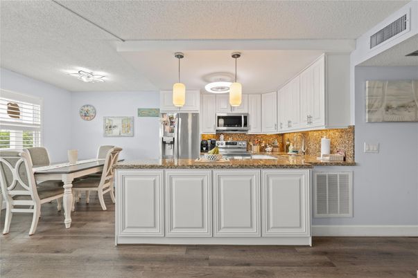 Dining room, Interior, Kitchen, Pendant Lights, Stainless Steel Appliances, Wood Texture Flooring