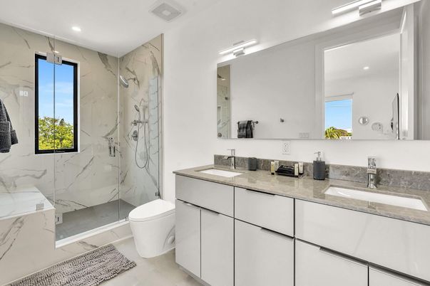 Bathroom, Dual Sink Vanities, Glass Shower, Interior, Marble Walls, Recessed Lighting