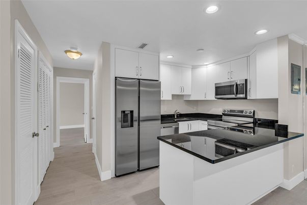 Interior, Kitchen, Recessed Lighting, Stainless Steel Appliances, Wood Texture Flooring