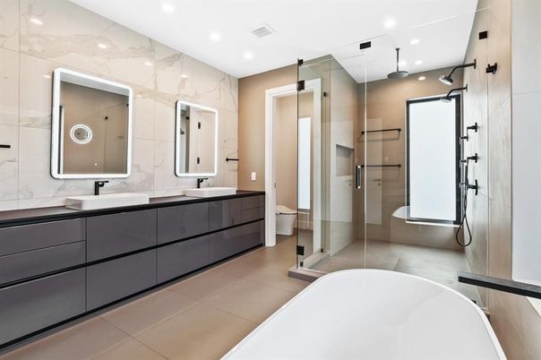 Bathroom, Dual Sink Vanities, Free Standing Baths, Glass Shower, Interior, Marble Walls, Recessed Lighting
