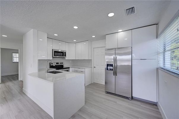 Interior, Kitchen, Recessed Lighting, Stainless Steel Appliances, Wood Texture Flooring