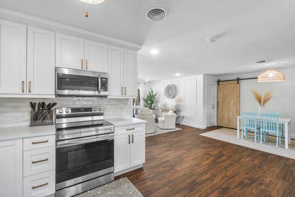 Dining room, Interior, Kitchen, Recessed Lighting, Stainless Steel Appliances, Wood Texture Flooring