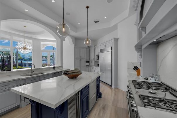 Chandelier, Interior, Kitchen, Pendant Lights, Recessed Lighting, Stainless Steel Appliances, Wood Texture Flooring