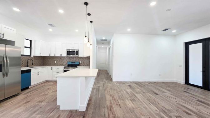 Interior, Kitchen, Pendant Lights, Recessed Lighting, Stainless Steel Appliances, Wood Texture Flooring