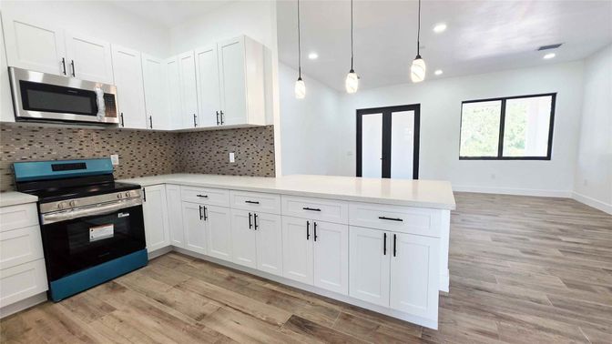 Interior, Kitchen, Pendant Lights, Recessed Lighting, Stainless Steel Appliances, Wood Texture Flooring