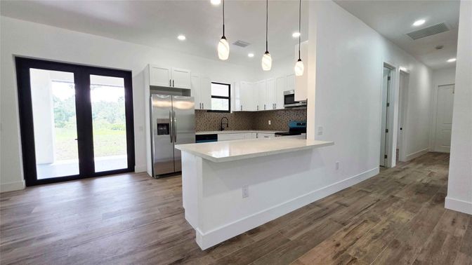 Interior, Kitchen, Pendant Lights, Recessed Lighting, Stainless Steel Appliances, Wood Texture Flooring