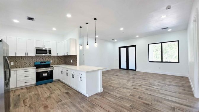 Interior, Kitchen, Pendant Lights, Recessed Lighting, Stainless Steel Appliances, Wood Texture Flooring