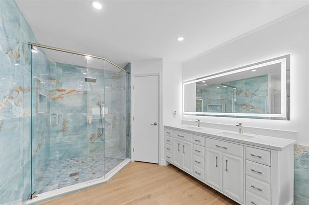 Bathroom, Dual Sink Vanities, Glass Shower, Interior, Recessed Lighting, Wood Texture Flooring