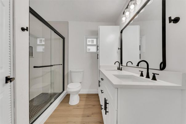 Bathroom, Dual Sink Vanities, Glass Shower, Interior, Wood Texture Flooring
