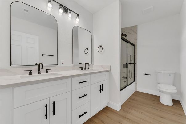 Bathroom, Dual Sink Vanities, Glass Shower, Interior, Marble Walls, Wood Texture Flooring