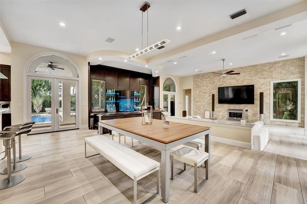 Dining room, Fireplace, Interior, Pendant Lights, Recessed Lighting, Stone Walls, Wood Texture Flooring