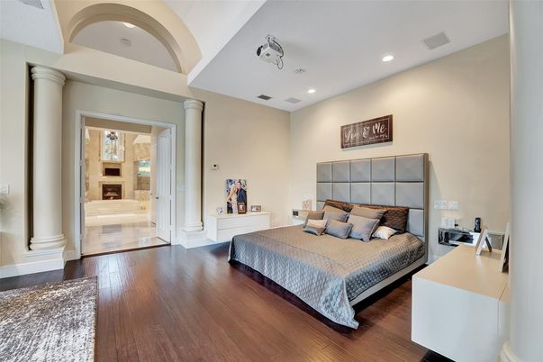 Bedroom, Fireplace, Interior, Recessed Lighting, Wood Texture Flooring