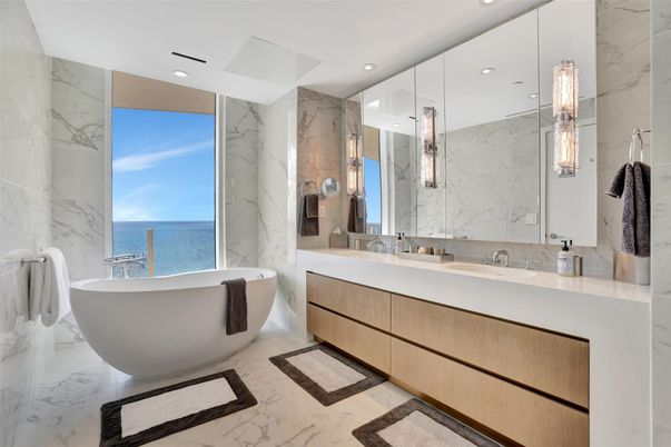 Bathroom, Dual Sink Vanities, Free Standing Baths, Glass Shower, Interior, Marble, Marble Walls, Recessed Lighting, Water