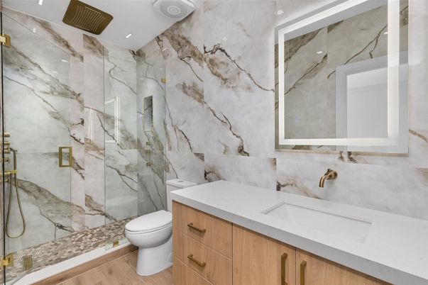 Bathroom, Glass Shower, Interior, Marble Walls, Recessed Lighting, Wood Texture Flooring