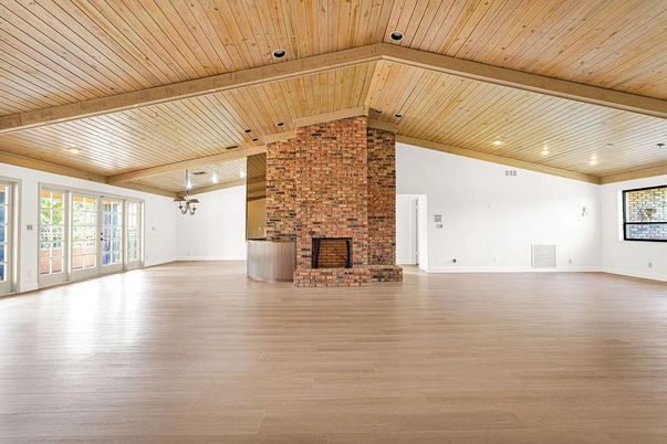 Empty room, Fireplace, Interior, Recessed Lighting, Stone Walls, Wooden Beams, Wooden Ceilings, Wood Texture Flooring