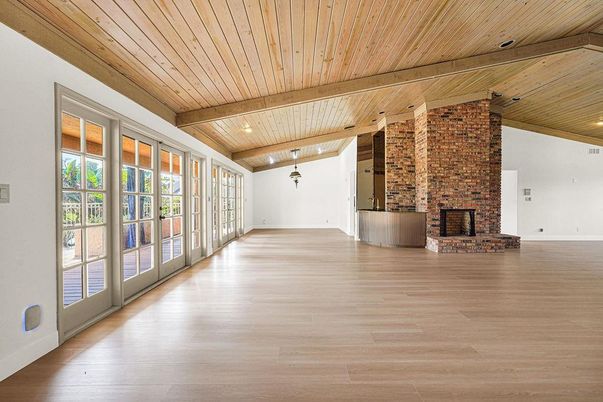 Empty room, Fireplace, Interior, Recessed Lighting, Stone Walls, Wooden Beams, Wooden Ceilings, Wood Texture Flooring