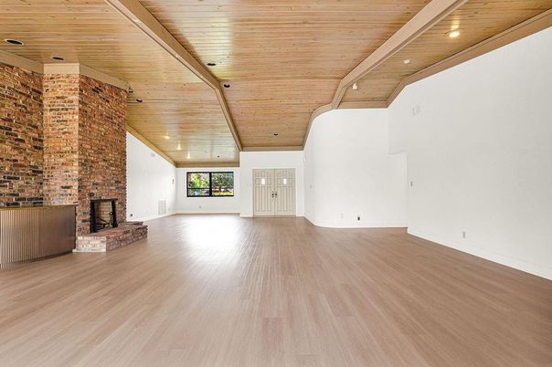 Empty room, Fireplace, Interior, Recessed Lighting, Stone Walls, Wooden Ceilings, Wood Texture Flooring