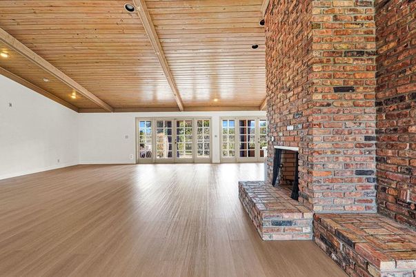 Empty room, Fireplace, Interior, Recessed Lighting, Stone Walls, Wooden Beams, Wooden Ceilings, Wood Texture Flooring