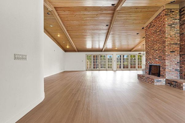 Empty room, Fireplace, Interior, Recessed Lighting, Stone Walls, Wooden Ceilings, Wood Texture Flooring