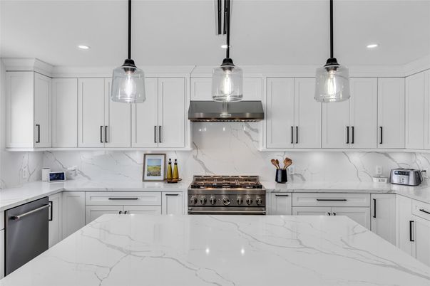 Interior, Kitchen, Marble Walls, Pendant Lights, Recessed Lighting, Stainless Steel Appliances