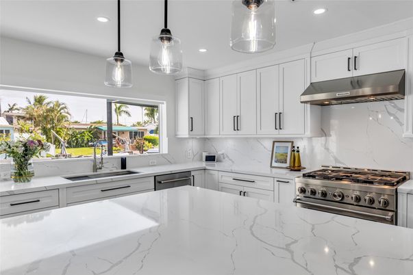 Interior, Kitchen, Marble Walls, Pendant Lights, Recessed Lighting, Stainless Steel Appliances