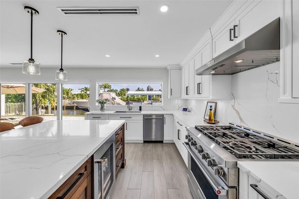 Interior, Kitchen, Marble Walls, Pendant Lights, Recessed Lighting, Stainless Steel Appliances, Wood Texture Flooring