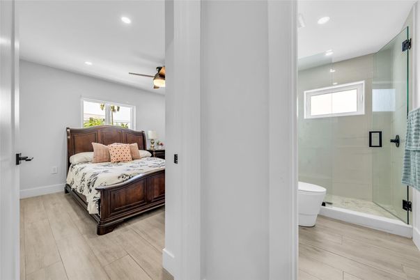 Bathroom, Bedroom, Glass Shower, Interior, Recessed Lighting, Wood Texture Flooring