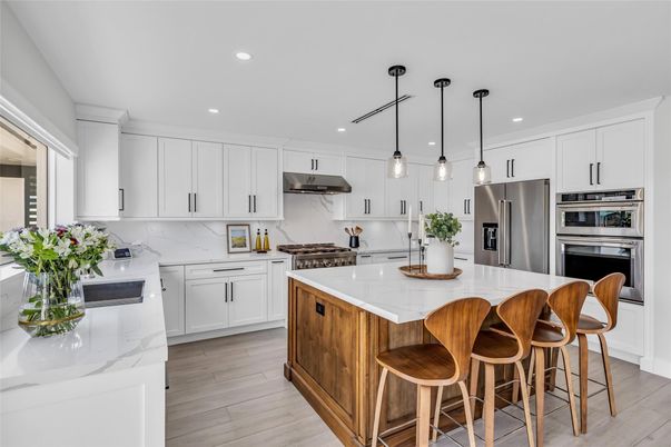 Interior, Kitchen, Marble Walls, Pendant Lights, Recessed Lighting, Stainless Steel Appliances, Wood Texture Flooring