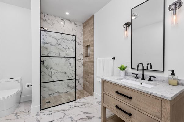 Bathroom, Dual Sink Vanities, Glass Shower, Interior, Marble, Marble Walls, Recessed Lighting