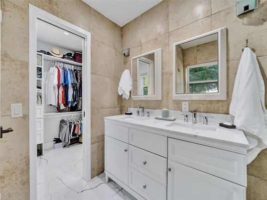 Bathroom, Dual Sink Vanities, Interior, Marble, Recessed Lighting, Walk-in Closets