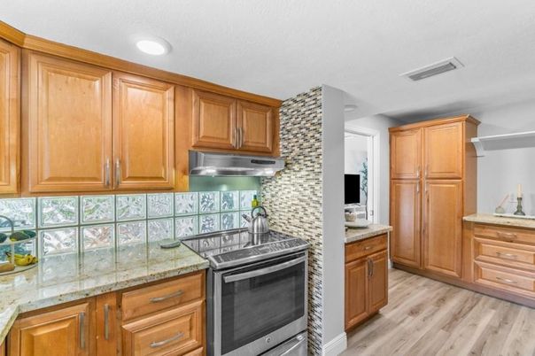 Interior, Kitchen, Recessed Lighting, Tile Countertops, Wood Texture Flooring
