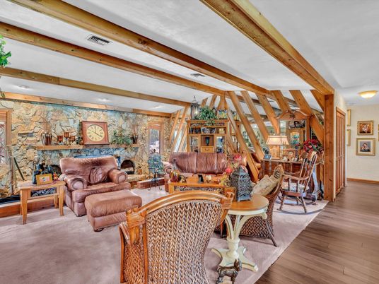 Dining room, Fireplace, Interior, Living room, Stone Walls, Wooden Beams, Wood Texture Flooring
